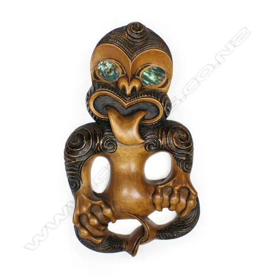 Rangi Redman (1924-) carved kauri tiki with hands clasped to thighs,