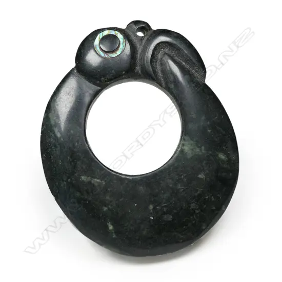 A Mike Higgs carved pounamu stylised Māori pendant,