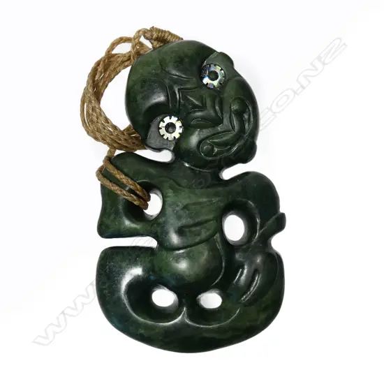A Scott Parker Arahura pounamu hei tiki with serrated inlaid eyes,