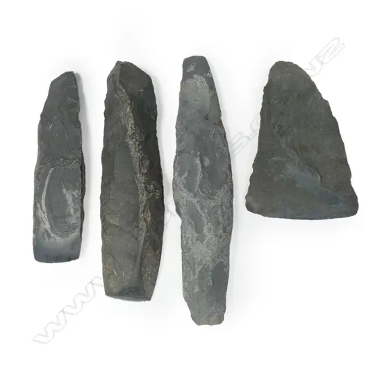 Four part-rubbed granite adzes,