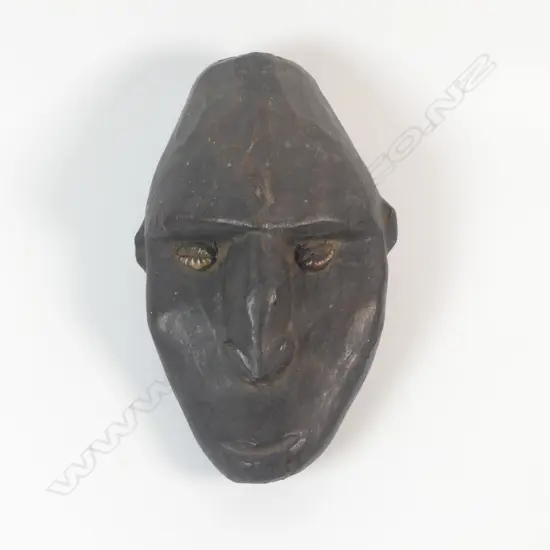 A carved wooden head,