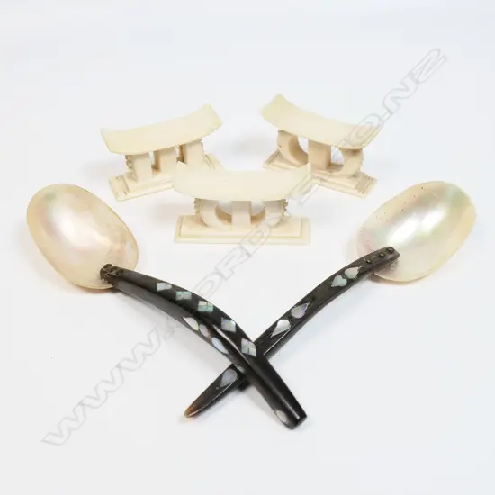 Three African miniature ivory headrests (a pair and one other) together with a pair of tribal spoons,