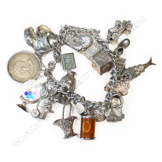 A good vintage 21 charm silver bracelet,