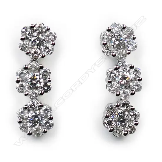 A pair of 18ct white gold and diamond earrings,