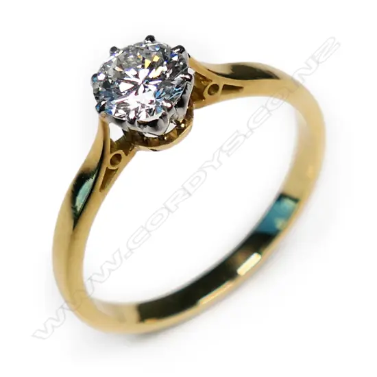 An estate18ct gold and diamond solitaire ring,