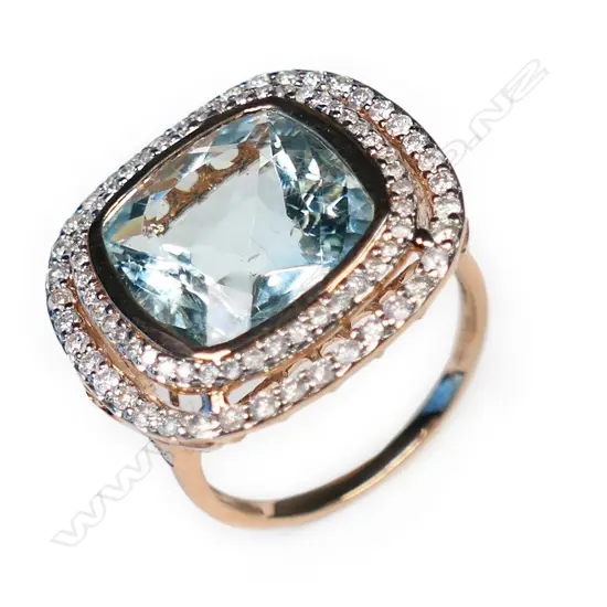 A 14ct rose gold, aquamarine and diamond double halo ring,