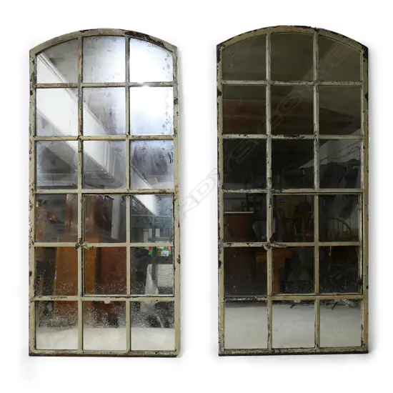 A pair of large French cast iron mirror windows,