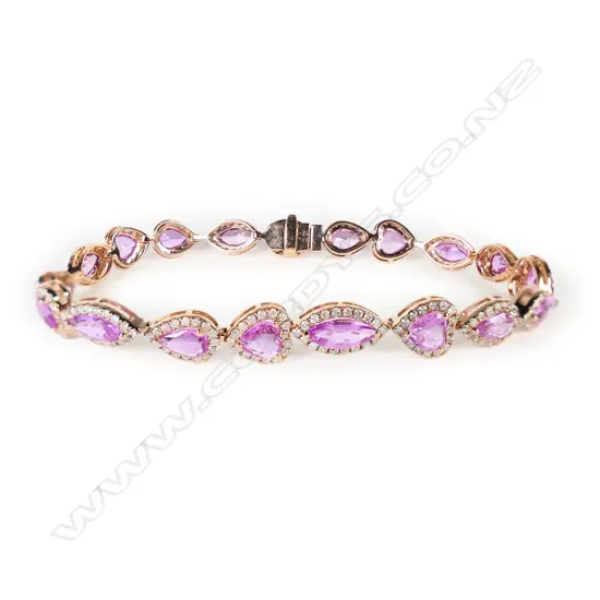 A 14ct rose gold pink sapphire and diamond halo bracelet,
