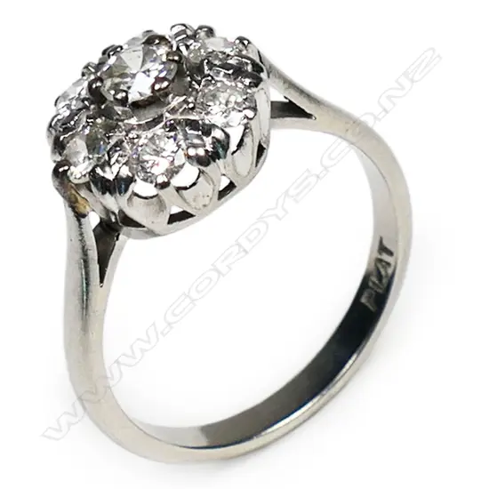 An estate platinum and diamond cluster ring,