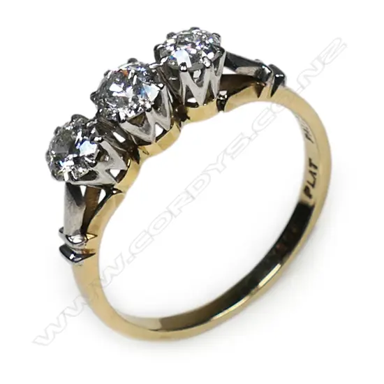 An estate 18ct gold and three stone diamond ring,