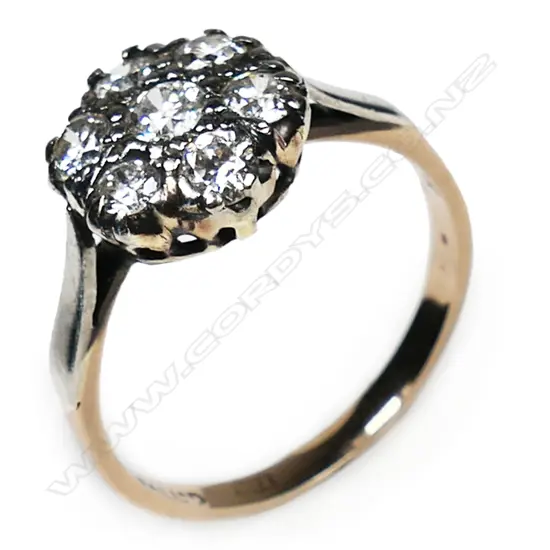 An estate 18ct gold and diamond cluster ring,