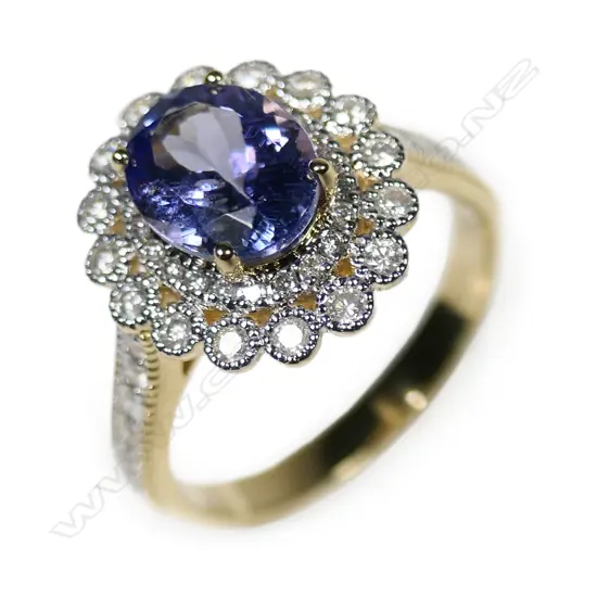 A 14ct gold tanzanite and diamond double halo ring,