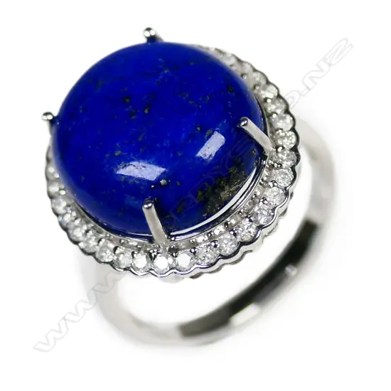 A 14ct white gold lapis lazuli and diamond halo ring,
