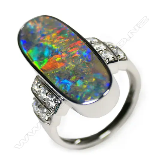 A 14ct white gold black opal and diamond ring,