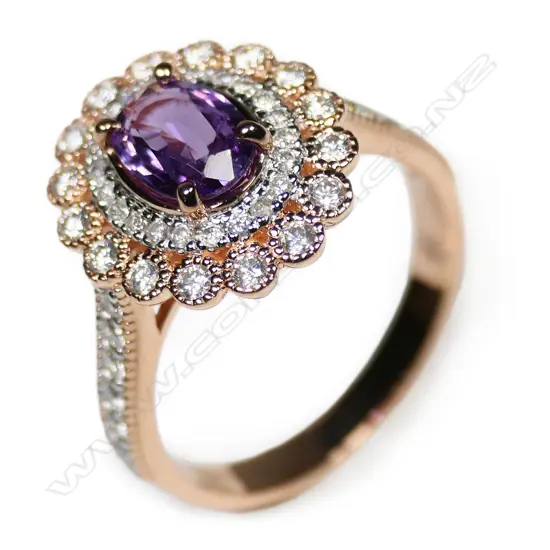 A 14ct rose gold pink sapphire and diamond double halo ring,