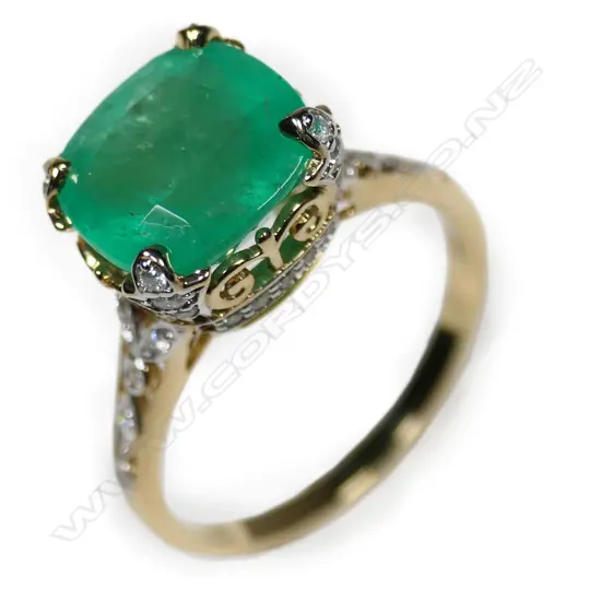 A 14ct yellow and white gold Colombian emerald and diamond cocktail ring,
