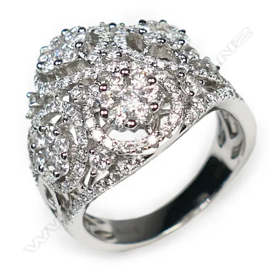A large 18ct white gold and diamond encrusted ring,