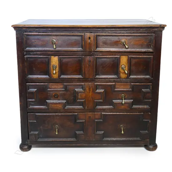 An antique oak William and Mary style chest of drawers,
