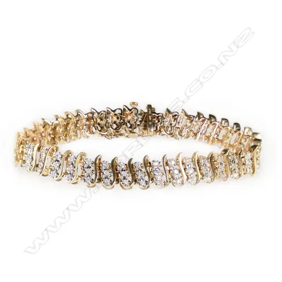 A 14ct yellow gold and diamond bracelet,