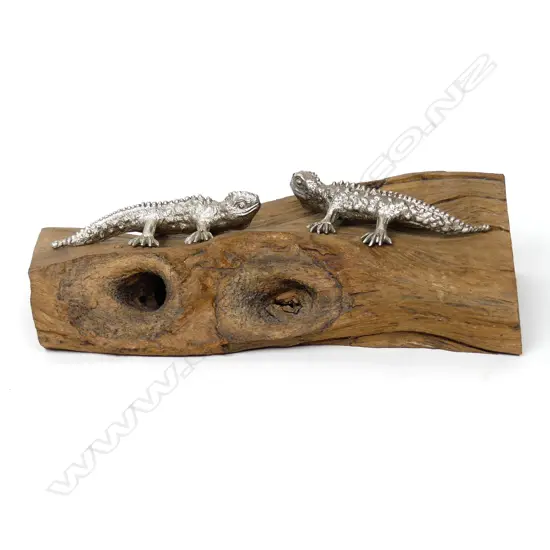 A pair of cast silver tuatara by John Money,