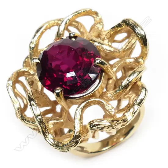 A large vintage designer 14ct yellow gold and garnet ring,