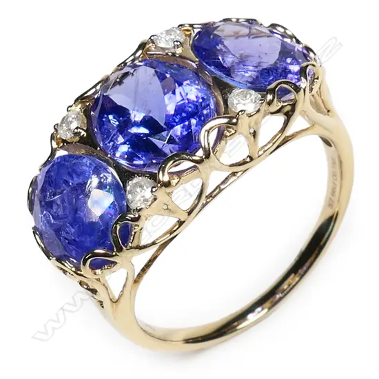 A 14ct gold tanzanite and diamond vintage style trilogy ring,