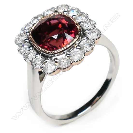 A 14ct rose and white gold tourmaline and diamond halo ring,