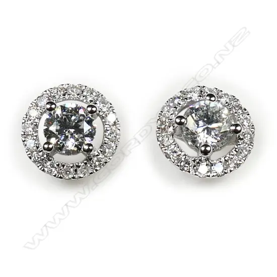 A pair of 18ct white gold and diamond cluster earrings,