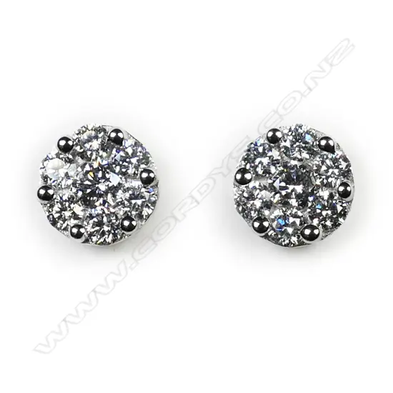 A pair of 18ct white gold and diamond cluster earrings,