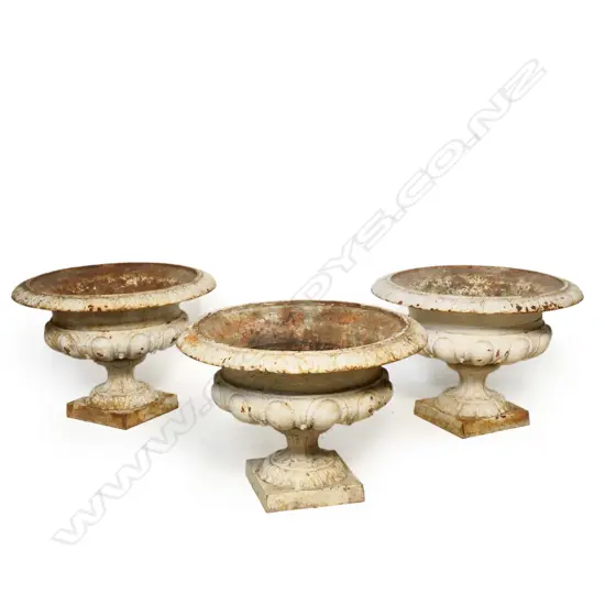 Three vintage cast iron garden urns,