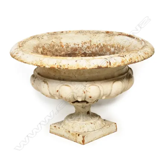 A vintage cast iron garden urn,