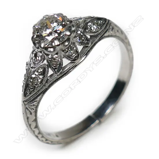 An estate platinum and diamond solitaire ring,
