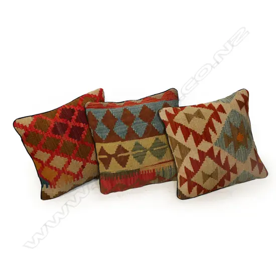 Three scatter cushions with various old kilim faces,
