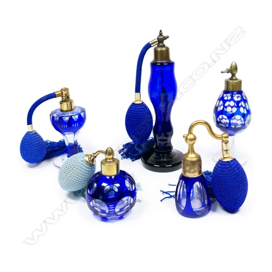 Five vintage cobalt blue perfume bottles,
