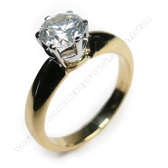 An 18ct yellow and white gold diamond solitaire ring,