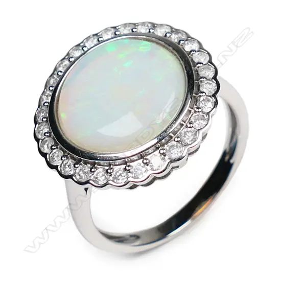 A 14ct white gold, opal and diamond halo ring,