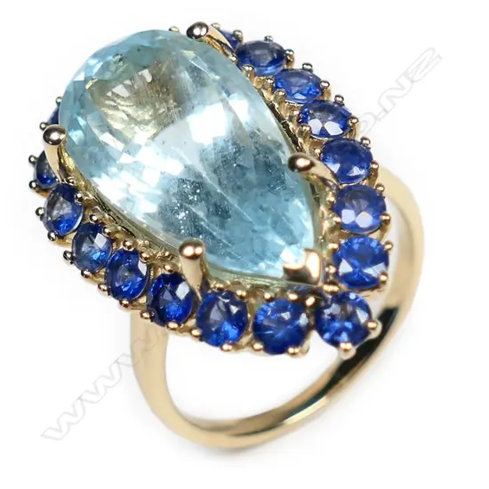 A 14ct gold aquamarine and sapphire halo cocktail ring,