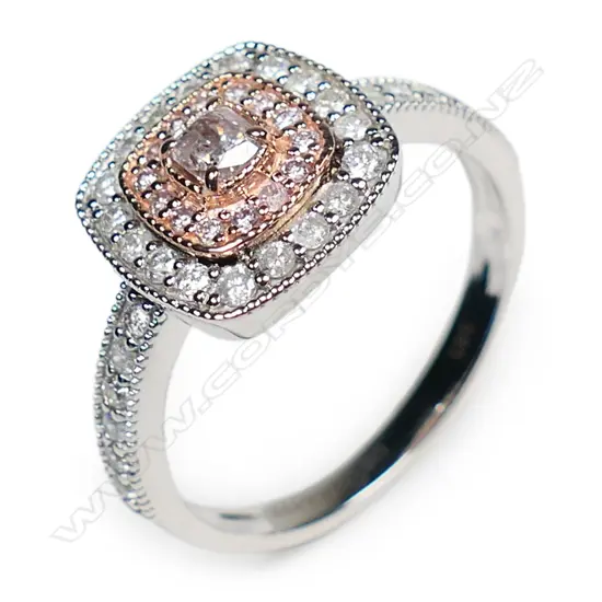 A 14ct white and rose gold pink diamond double halo ring,
