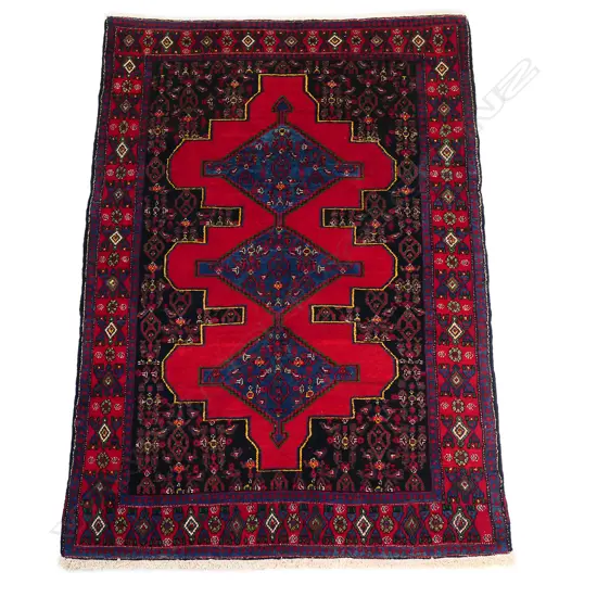 A Persian Hamadan hand-knotted wool pile rug,