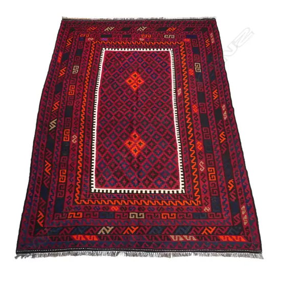 A hand-woven kilim carpet,