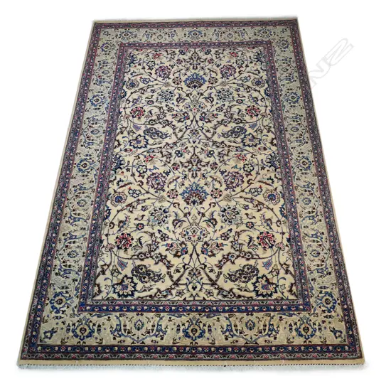 A hand-knotted Persian Kashan rug,