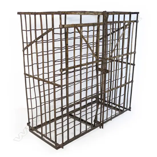 A medium antique French steel wine cage,