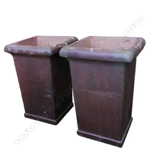 A pair of tall ironstone garden planters,