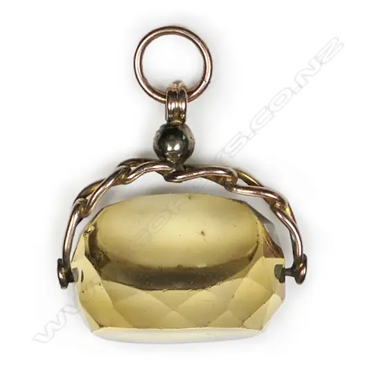 A c.1900 9ct gold and citrine fob spinner,