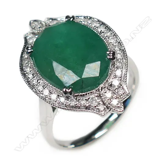 A 14ct white gold, emerald and diamond antique style ring,