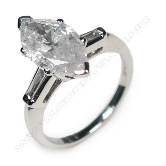 A platinum and diamond trilogy ring,