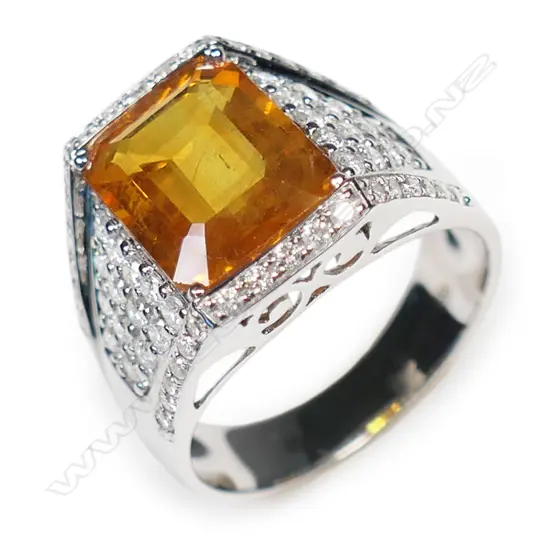 A 14ct white gold orange sapphire and diamond gent's ring,