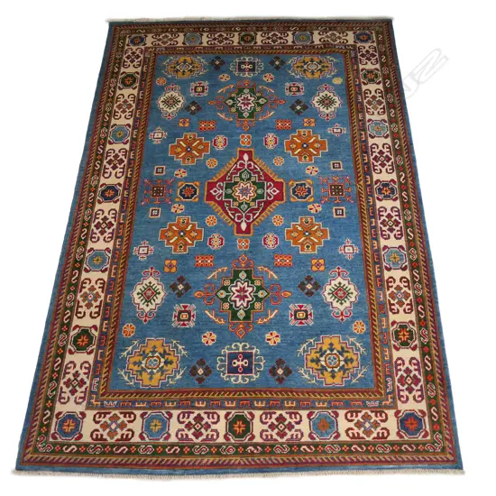 A hand knotted wool pile Kazak rug,
