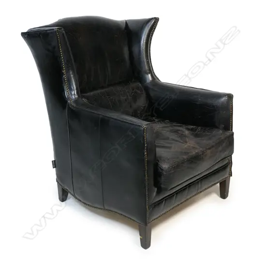 A leather wingback club chair,