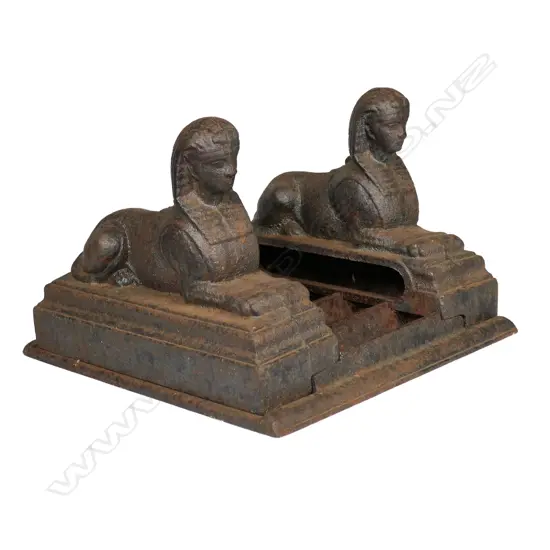 An old cast iron sphinx boot scraper,